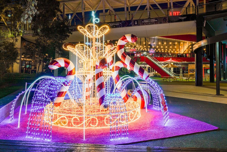 An illuminated festive installation in the outdoor space at District Docklands.