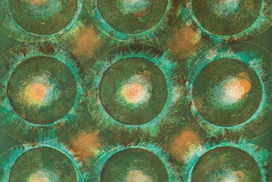 An abstract artwork comprising circles in shades of green, and pale yellow.