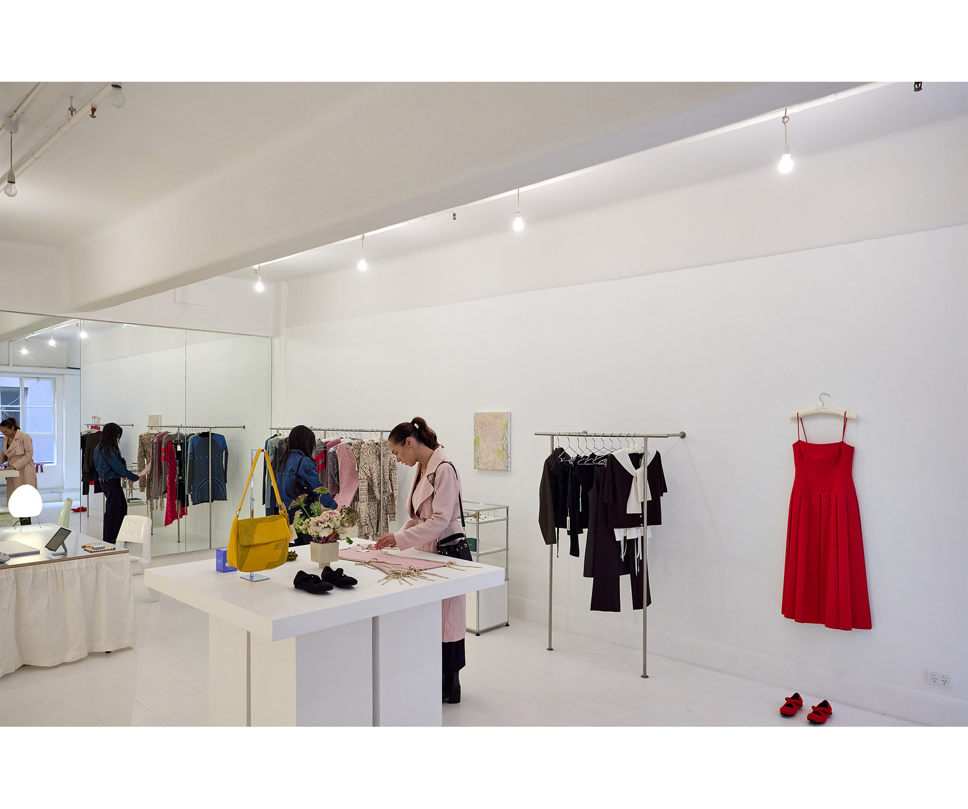 Two women browsing in an aesthetic clothing boutique 