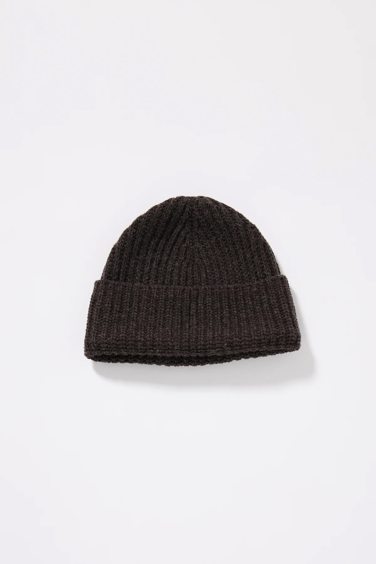 A dark brown ribbed beanie.