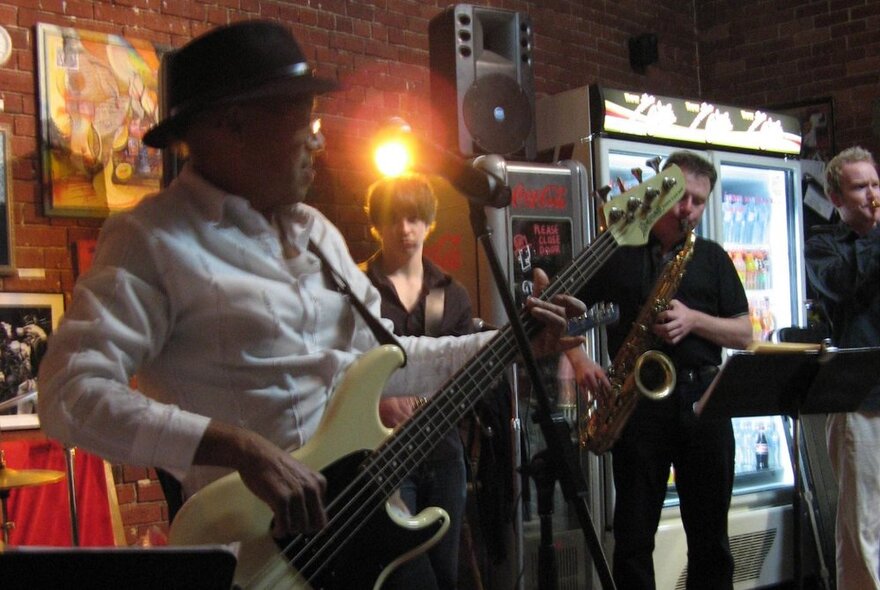Jazz musicians performing in a small venue.