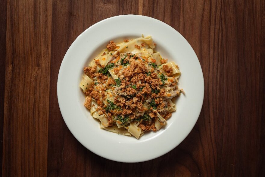 A dish of food on a wooden table.