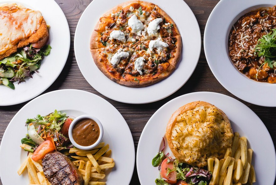 Pub meals, including pizza, steak and chips and pie and chips.