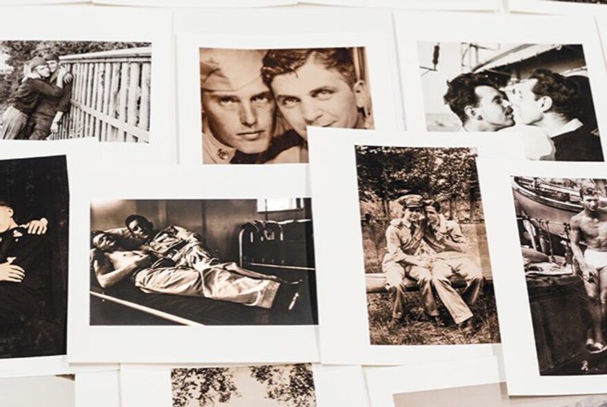 A collage of black and white photographs laid over the top of one another, showing portraits of loving male partnerships.