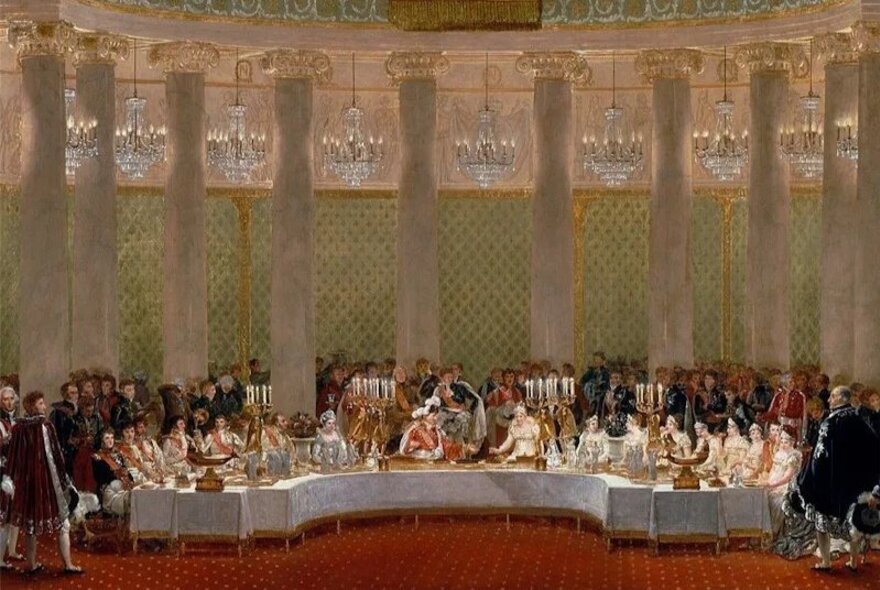 An oil painting of the French royal family eating a sumptuous feast on the eve of the Revolution, with an audience looking on.