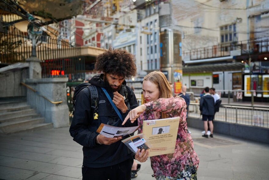 Participants with casebook paperwork looking for clues in the city.