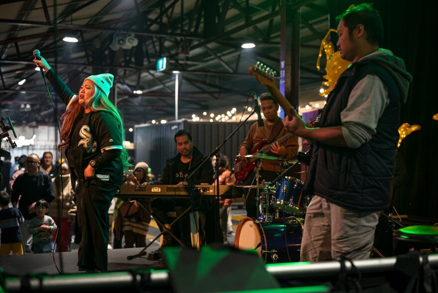 Performers on stage in Shed D at the Queen Victoria Market.