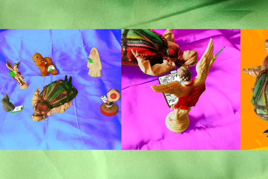 Small figurines arranged on coloured cloth as part of a drawing workshop.