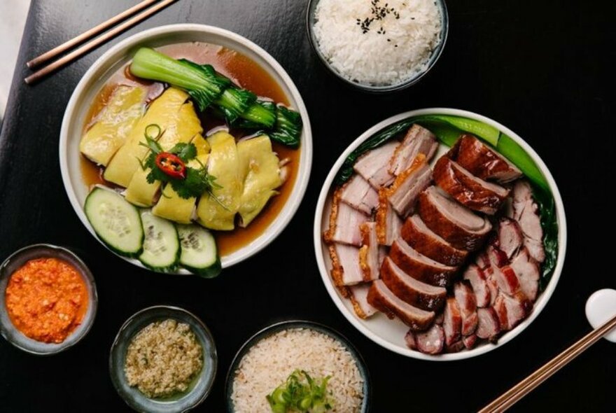 A selection of Asian dishes in bowls on a table