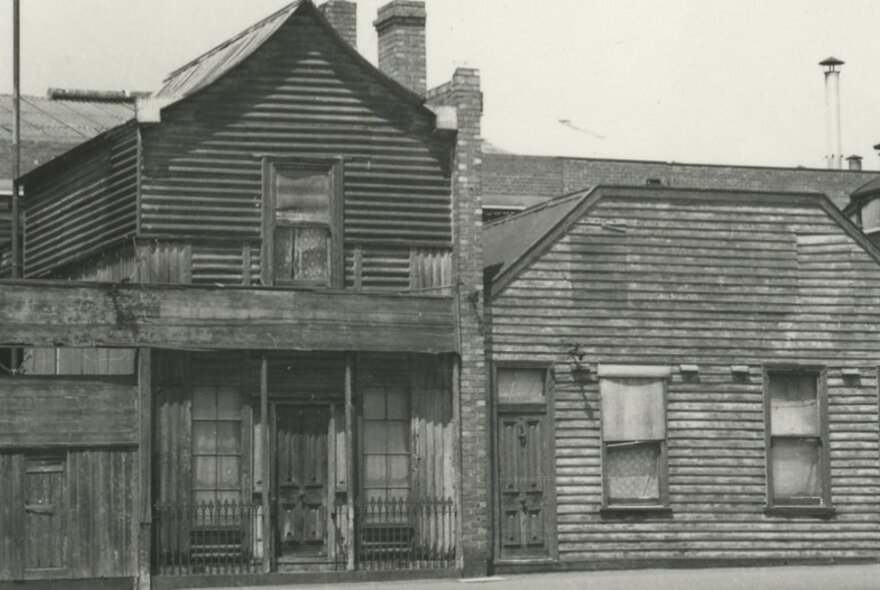 An early photograph of a two-storey timber building in North Melbourne.
