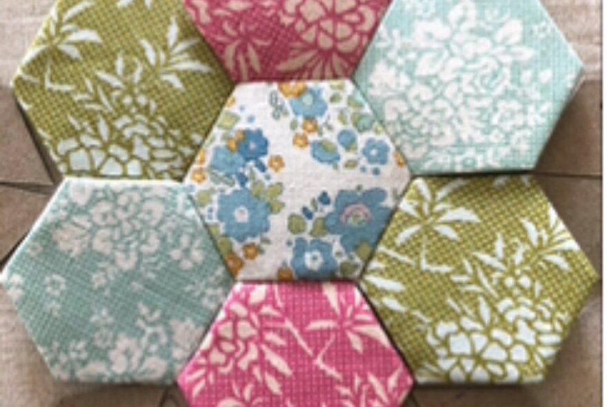 Fabric patchwork segments forming a pattern.