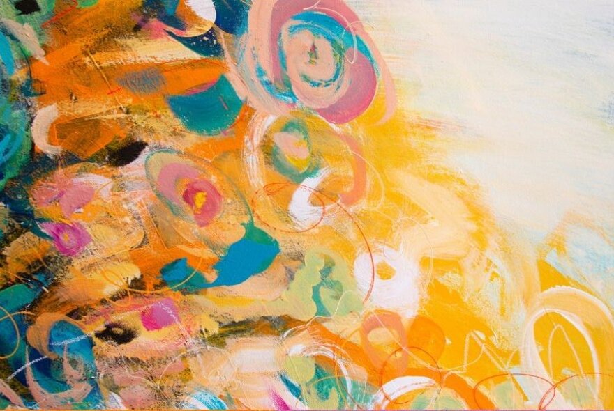 An abstract painting of swirls and blotches in shades of yellow, blue, pink and orange.