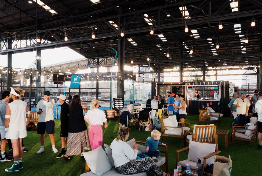 People gathered around a social outdoor space. 