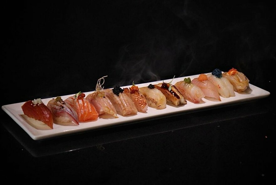 A long plate of Nigiri. 