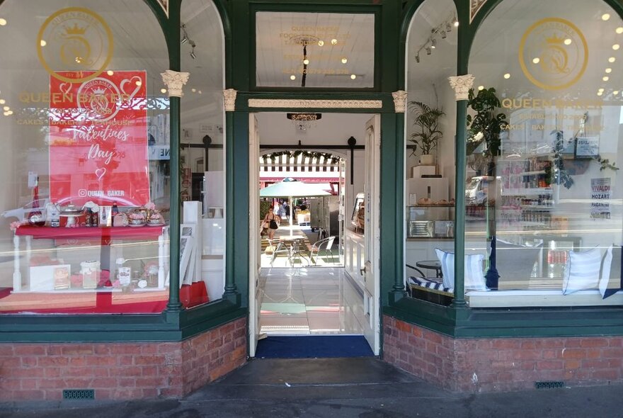 Queen Victoria Market shopfront with heritage front windows and green paint details.