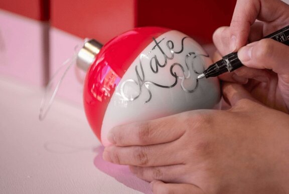 A personalised bauble with the name Kate on it.