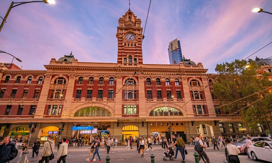 People walking by Flinders Street Station. 