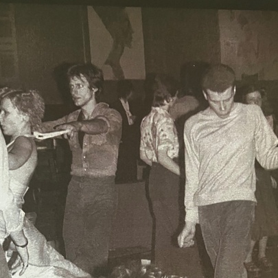 Vintage black-and-white photograph of young people dancing at a dance event, reminiscent of the energetic club scenes of the 1960s or 1970s.