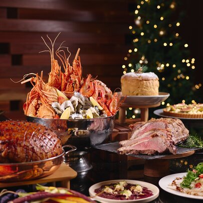Christmas buffet with meat, seafood and cakes.