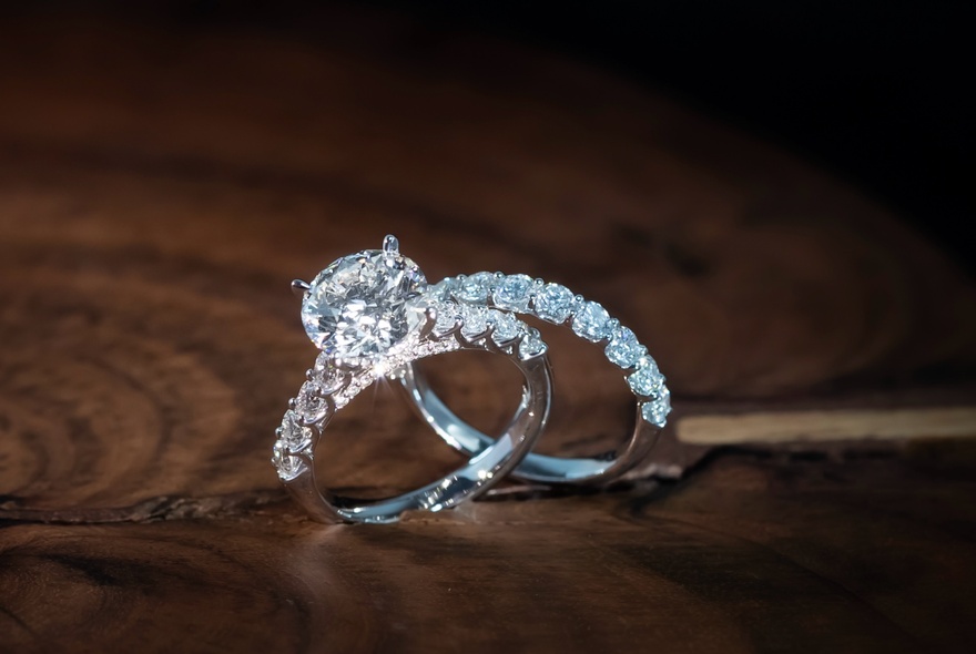 Two diamond rings, one with a large central diamond surrounded by smaller diamonds.