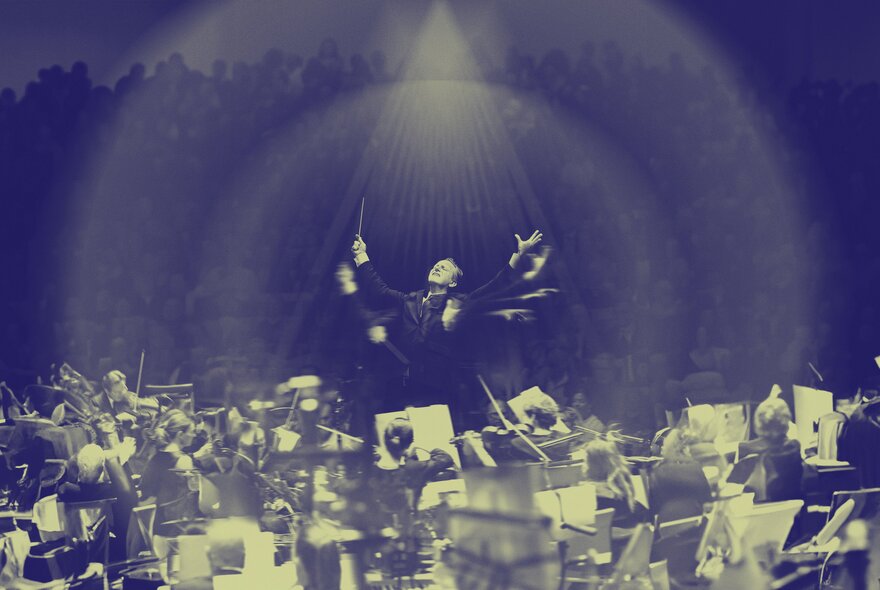 A seated orchestra playing their instruments while the central figure of the conductor moves his arms through the air, the black and white image capturing frame-by-frame movements to show his arms in motion.