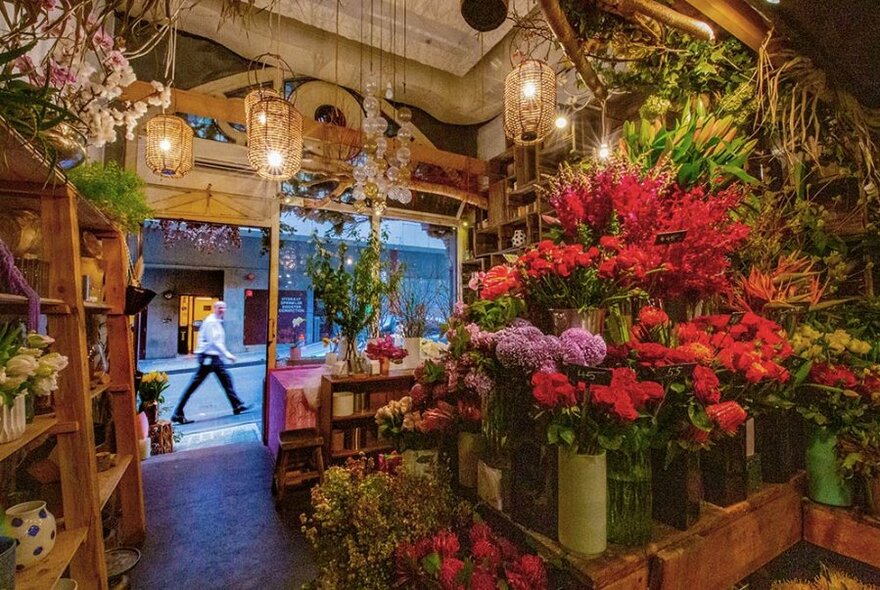 Inside florist shop full of cut flowers.