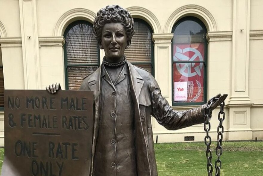 Statue of Zelda d'Aprano outside Trades Hall, carrying a banner and chains.