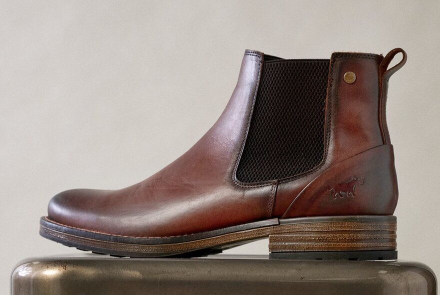 Side view of a single Chelsea boot in mid brown.