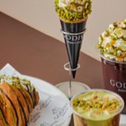 A selection of pistachio flavoured desserts, sweets and drinks at Godiva.