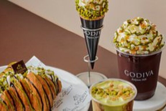 A selection of pistachio flavoured desserts, sweets and drinks at Godiva.