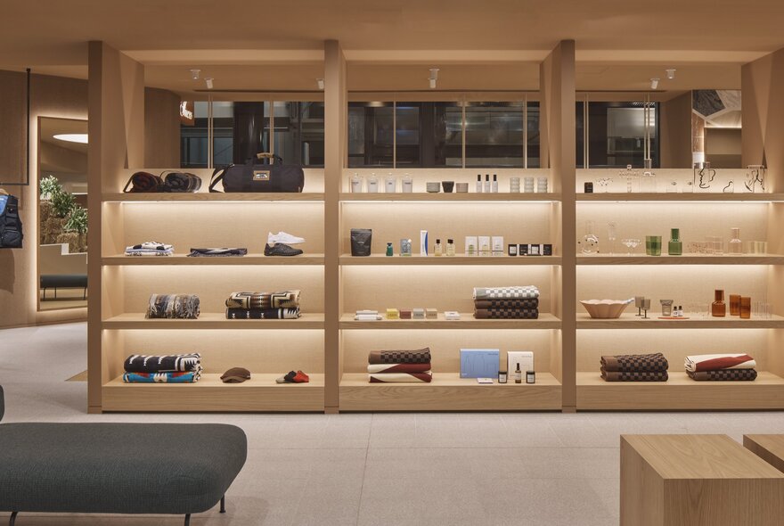 Interior of the shop Incu with shelves of goods on display inside an airy and light filled space.