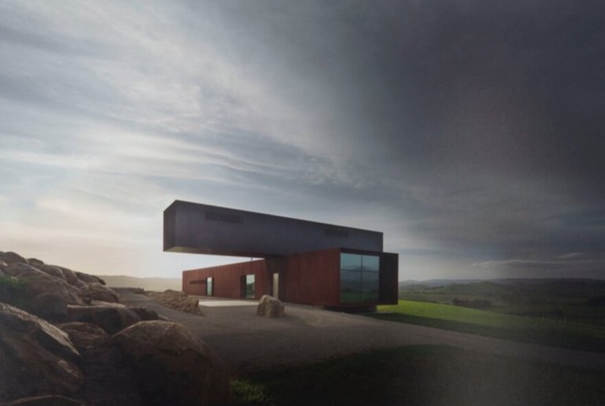 Landscape image of modernist, brutalist building on a hillside.