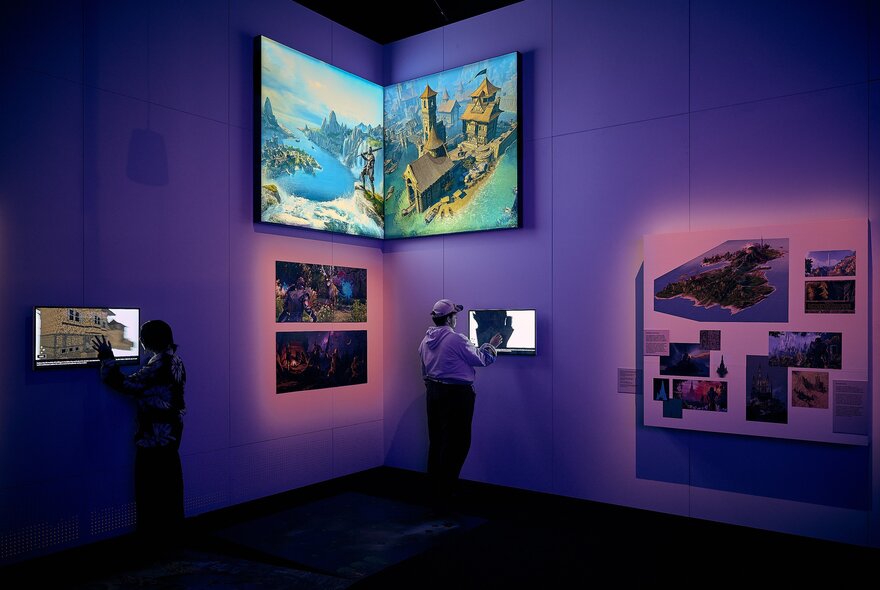 Purple-lit dark room with screens.