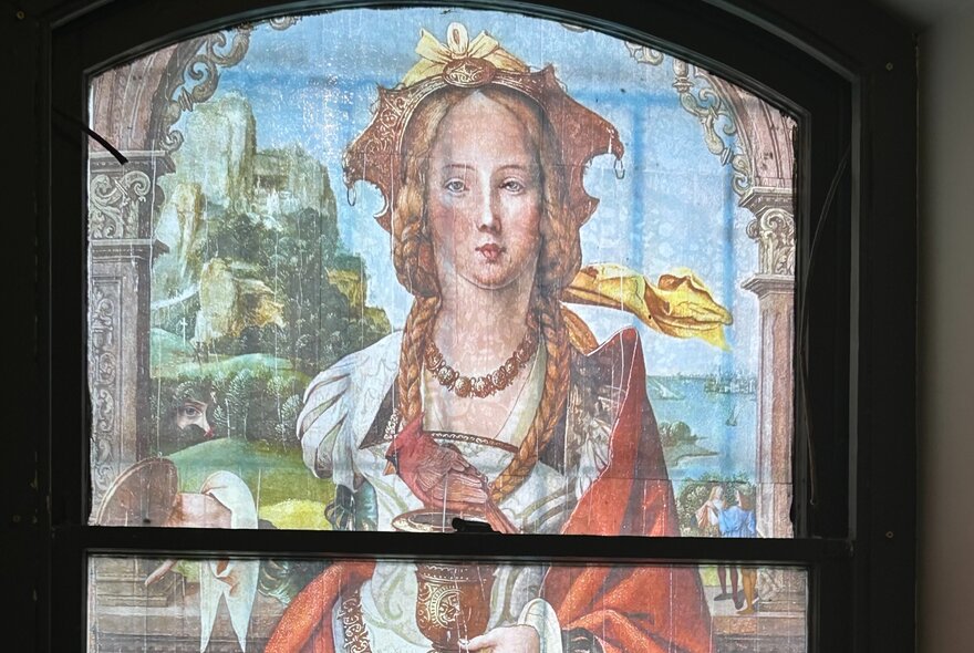 Renaissance-style painting of a woman screened onto a window frame.