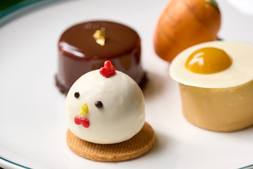 A close up of Easter themed mini desserts on a plate as part of a High Tea dining event.