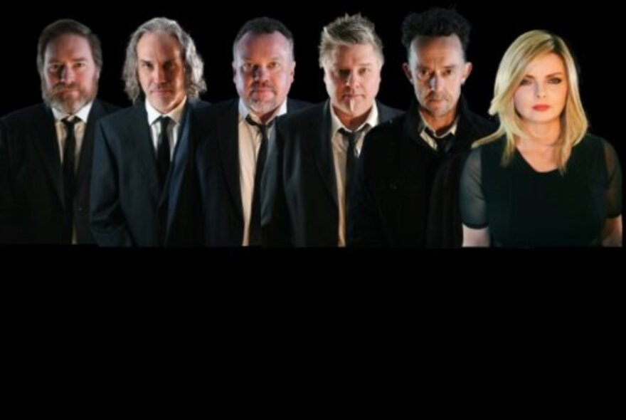 Blondie tribute band with female blonde singer and male group wearing ties.
