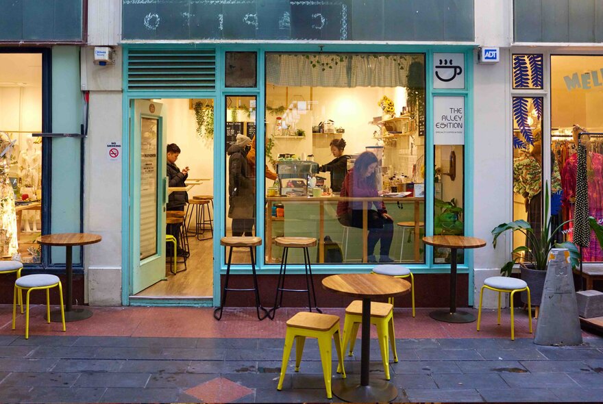 Outside a tiny cafe in a laneway