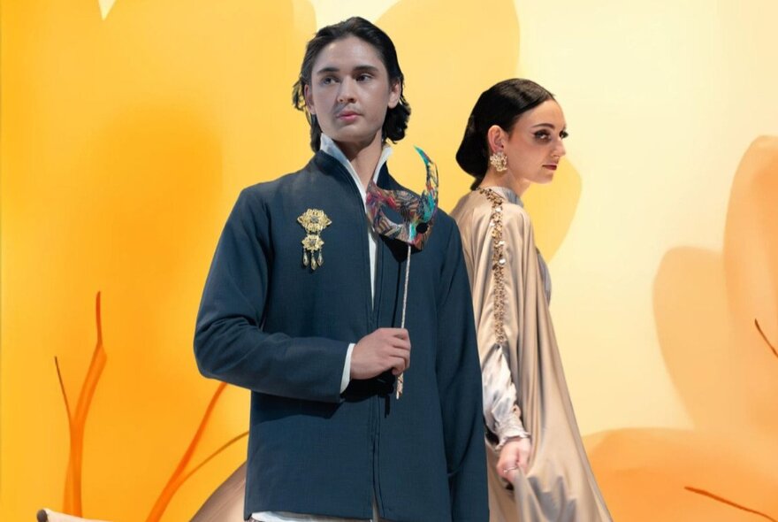Indonesian fashion models wearing modest gowns crudely photoshopped against a yellow background. 