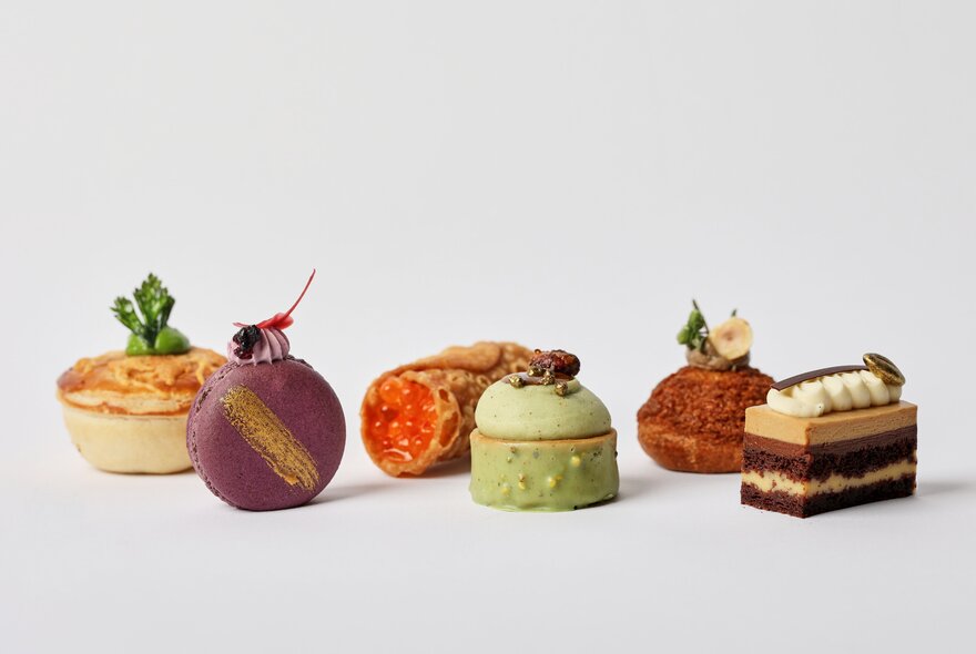 A selection of elegant petit fours and small pastries.