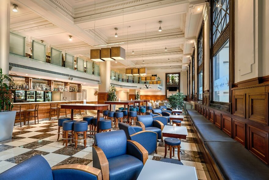 Large bar area with comfortable chairs and small tables.