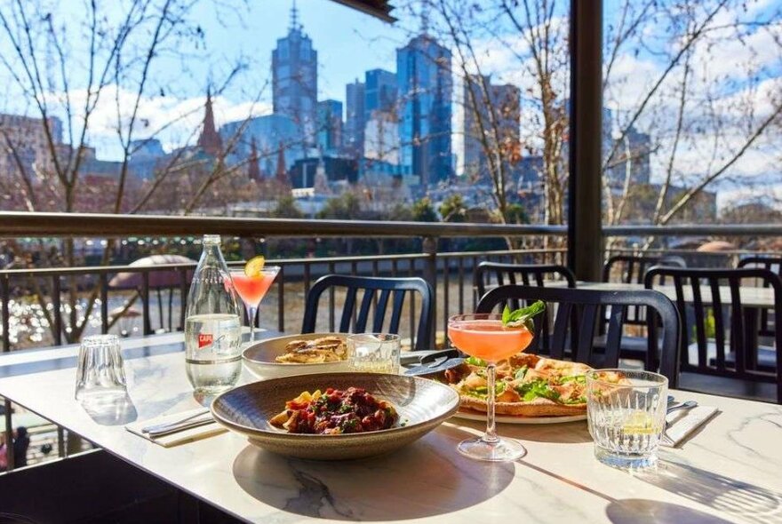 Food and cocktails on a table outside