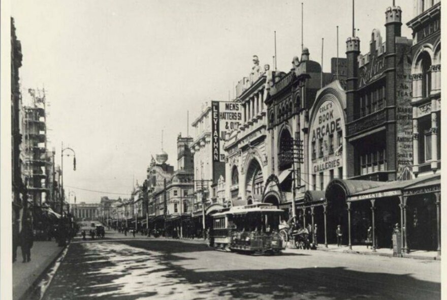 A black and white photo of a city street