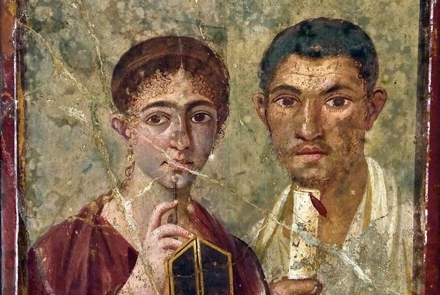 A painting, cracked with age, from ancient Pompei depicting a man and woman