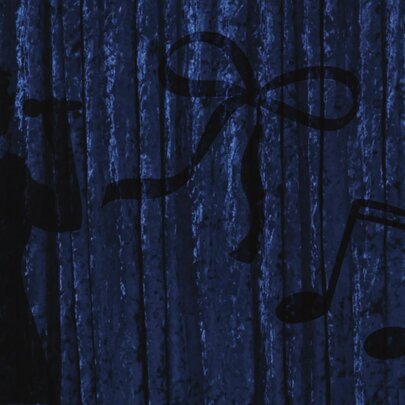 The silhouette of a person singing into a microphone against a dark blue curtain.