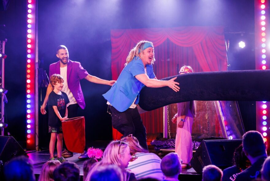 Two children's performers on stage performing a magic show.