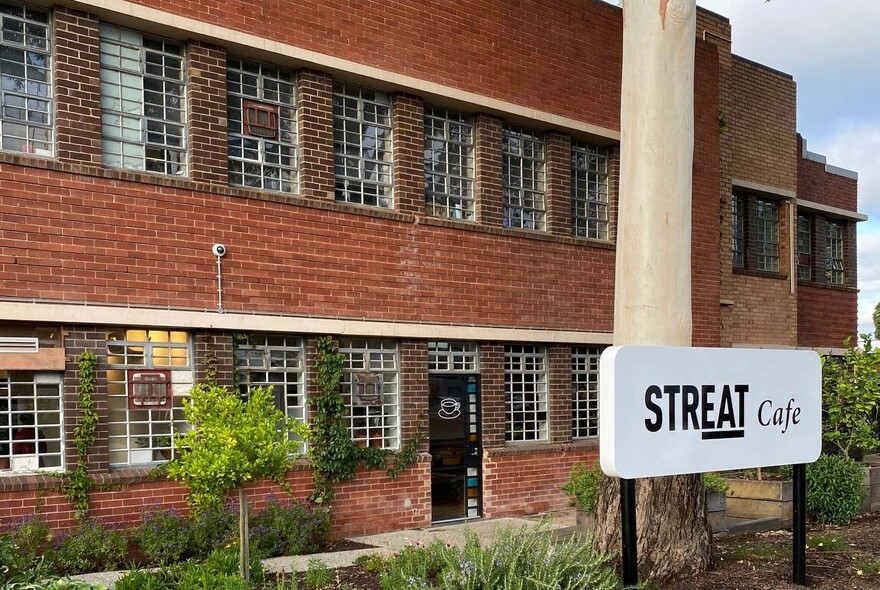 Old double-storey brick building housing Streat cafe in Parkville.