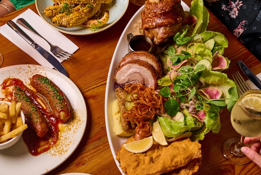 A dining table laden with plates of traditional German food.