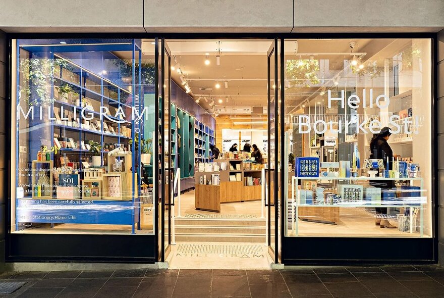 Milligram storefront with signage, steps leading into interior lined with shelves and displays.