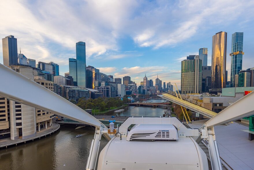 The view from a Ferris Wheel overlooking the city and river.