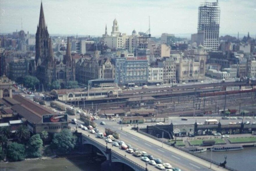 A photo taken from the air of Princes Bridge over the Yarra and the old buildings of Melbourne